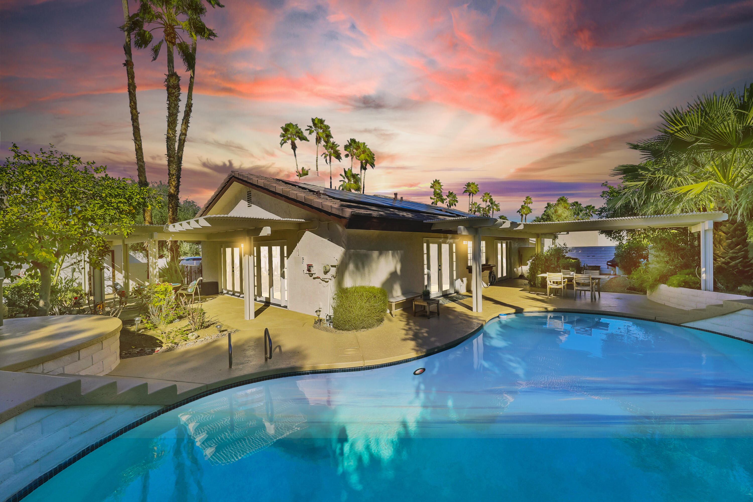 a view of a swimming pool with a patio