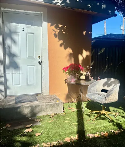 a view of a swimming pool with an outdoor seating