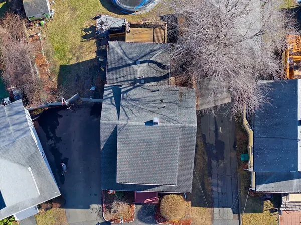 a view of a house with a tree in the background