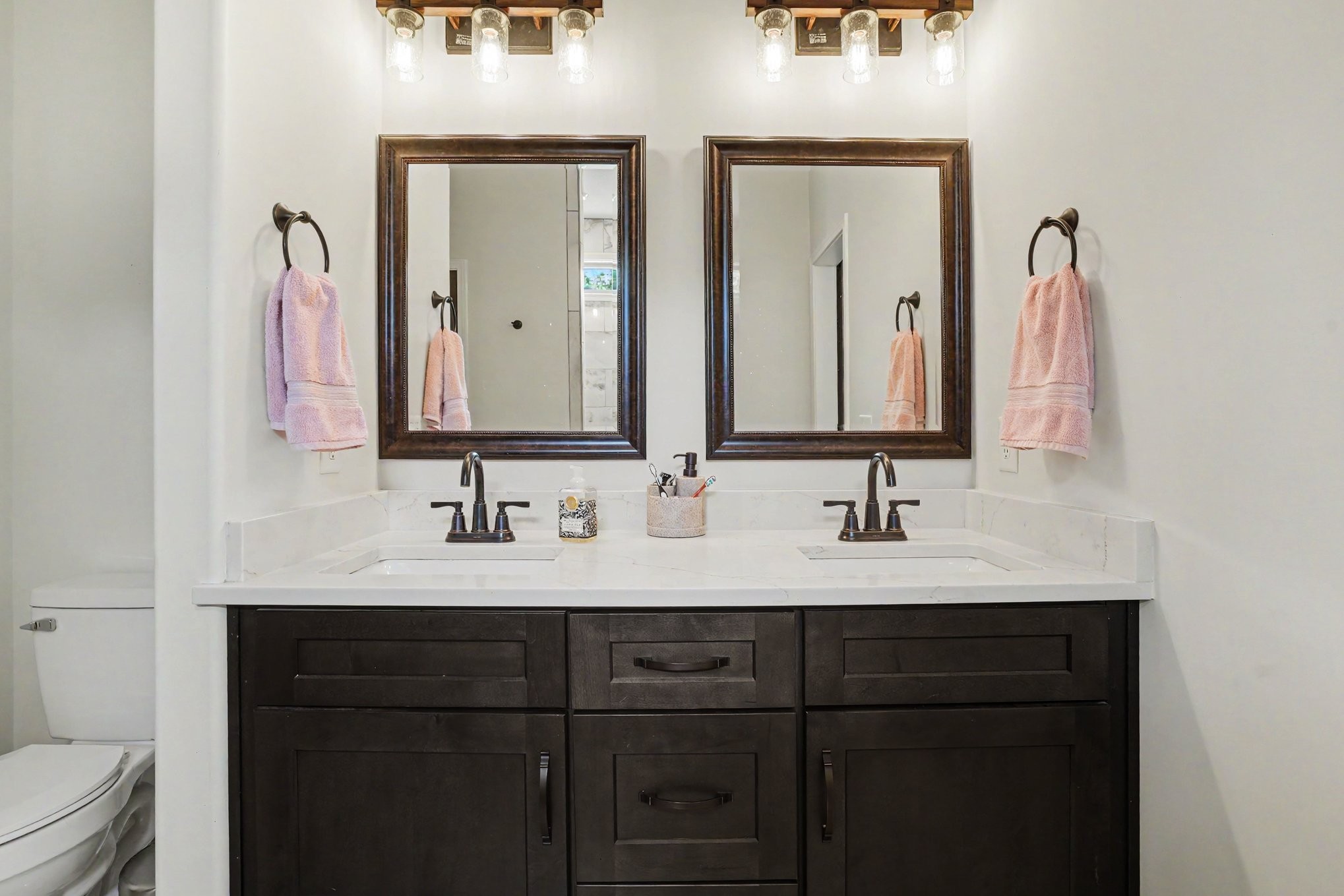 1415 Southside Road Southside, TN 37171 - Photo 18 of 35 a bathroom with double vanity sinks and a mirror