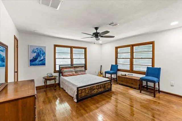 a living room with a bed furniture and a window