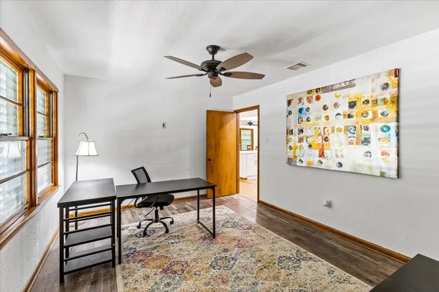 a workspace with furniture and window