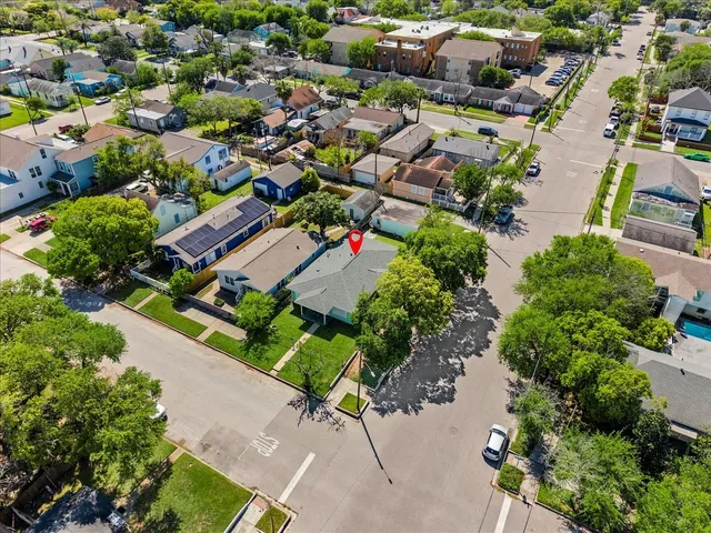 an aerial view of residential houses with outdoor space