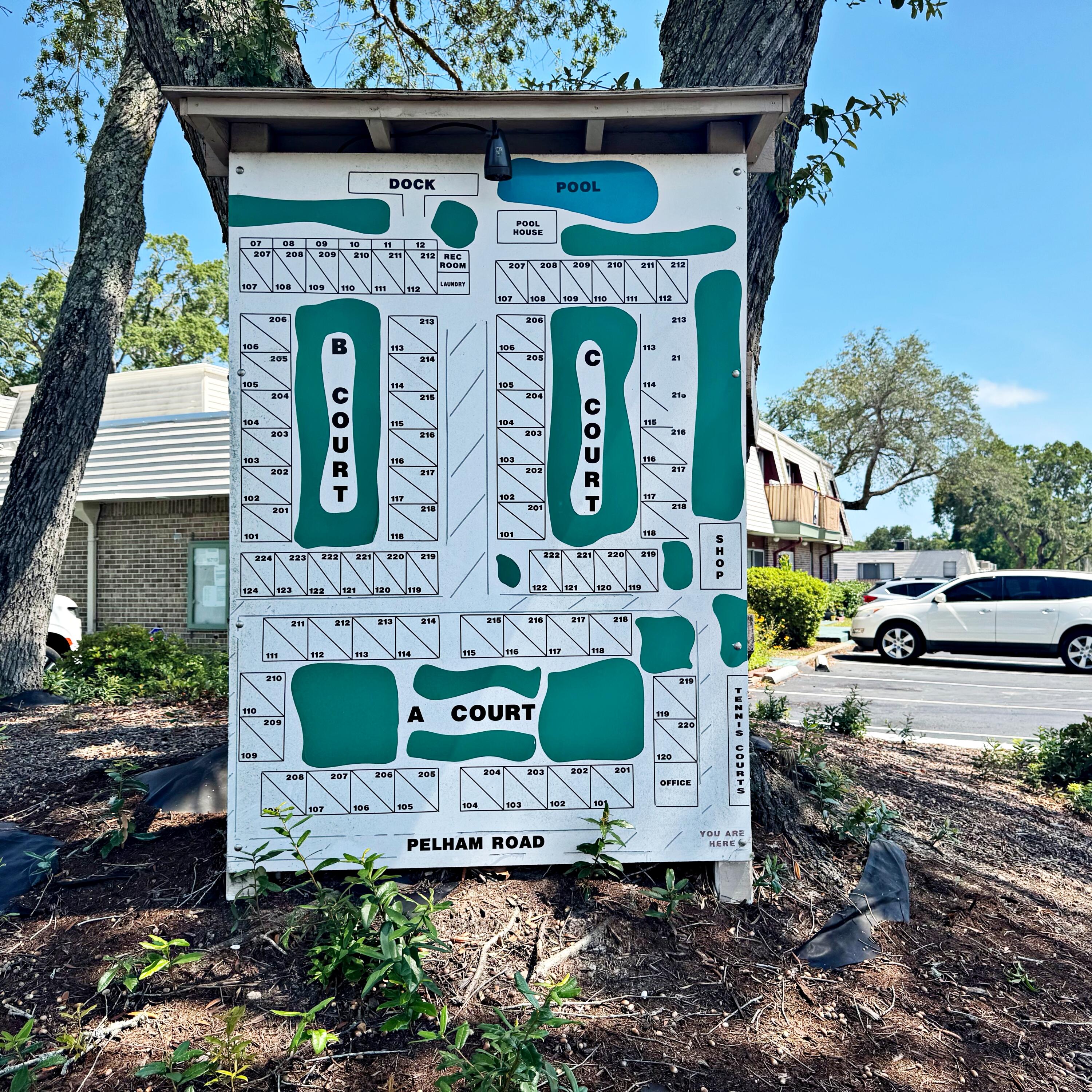 210 Pelham Road, Unit 215B Fort Walton Beach, FL 32547 - Photo 13 of 23 a front view of a house with a garden