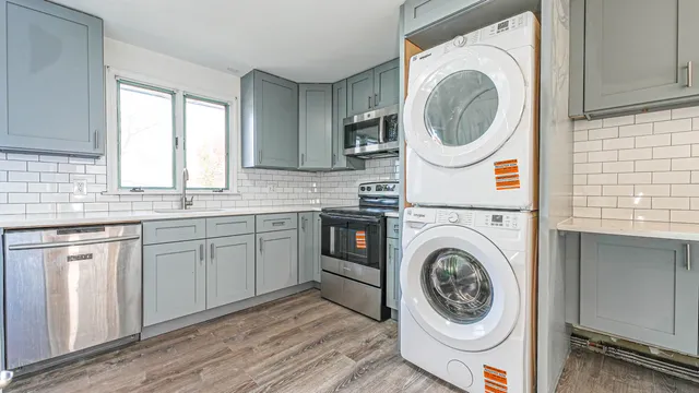 a kitchen with a washer and dryer