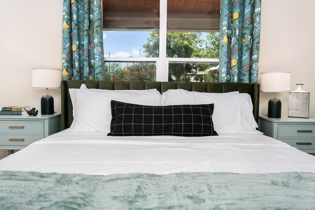 901 Bell Street Fredericksburg, TX 78624 - Photo 14 of 25 a large bed sitting in a bedroom next to a window