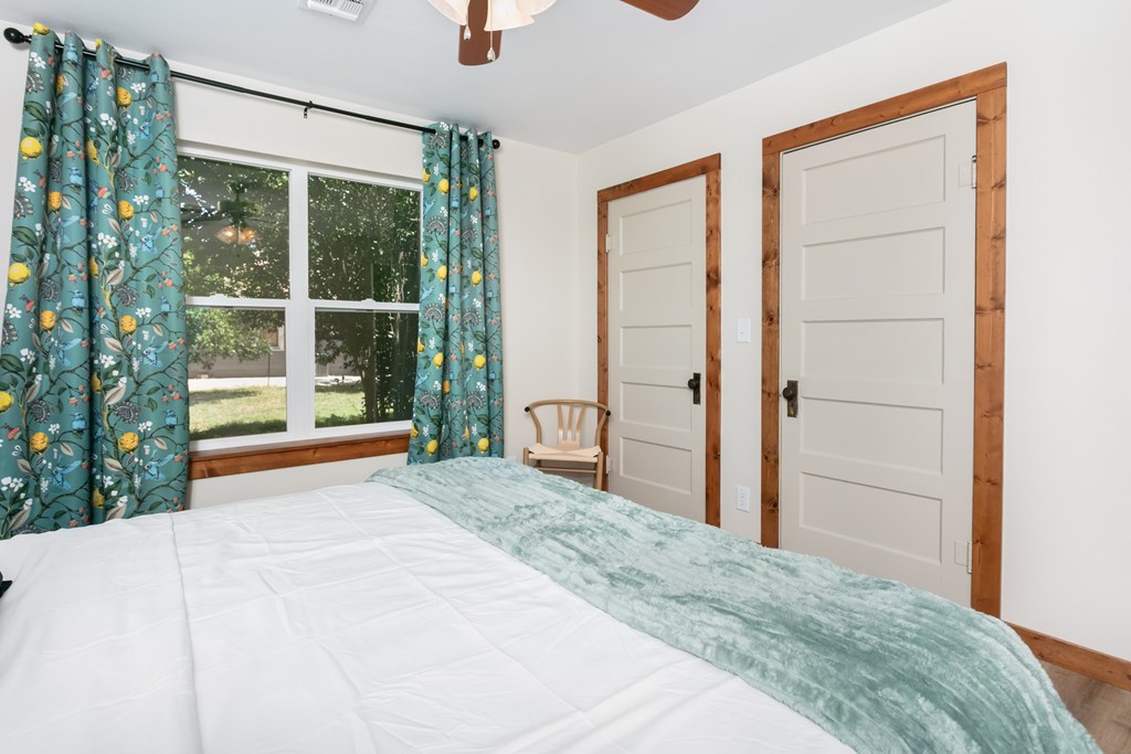 901 Bell Street Fredericksburg, TX 78624 - Photo 15 of 25 a bedroom with a bed and a large window