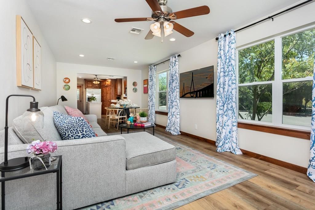 901 Bell Street Fredericksburg, TX 78624 - Photo 2 of 25 a living room with furniture and a flat screen tv