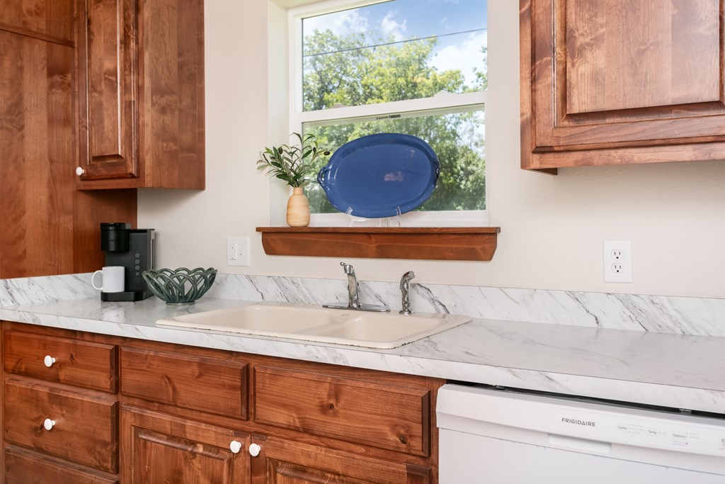 901 Bell Street Fredericksburg, TX 78624 - Photo 21 of 25 a sink with a stove and mirror