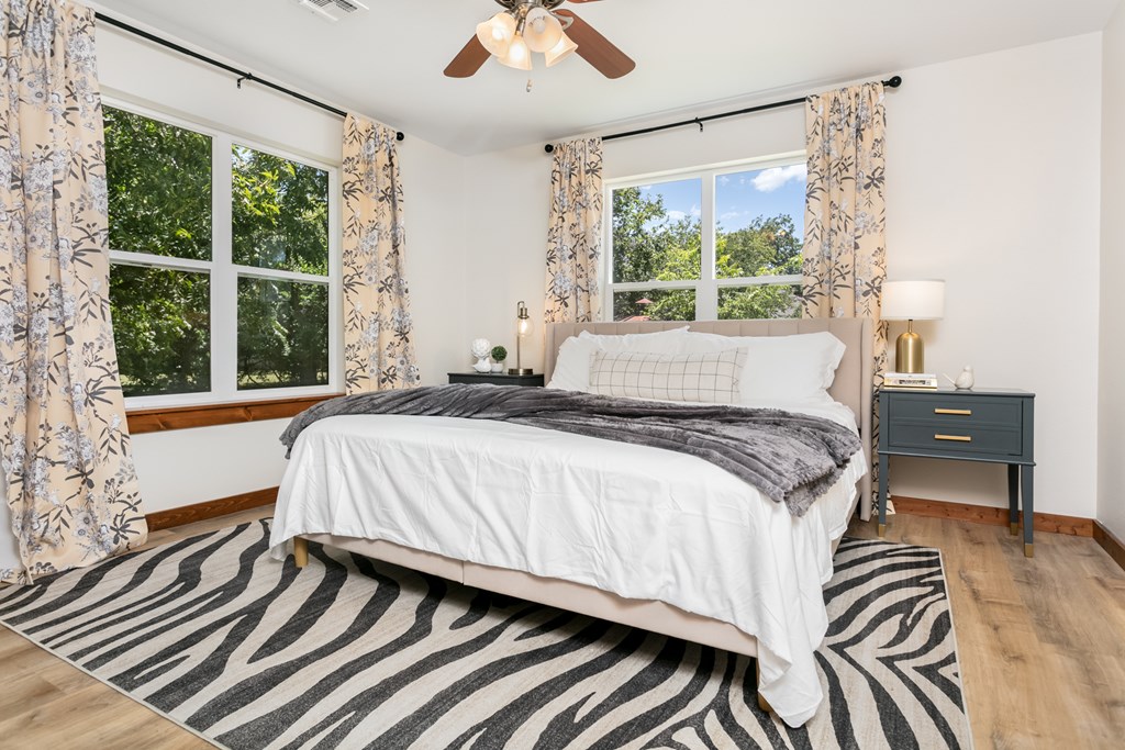 901 Bell Street Fredericksburg, TX 78624 - Photo 5 of 25 a bedroom with a bed and a large window