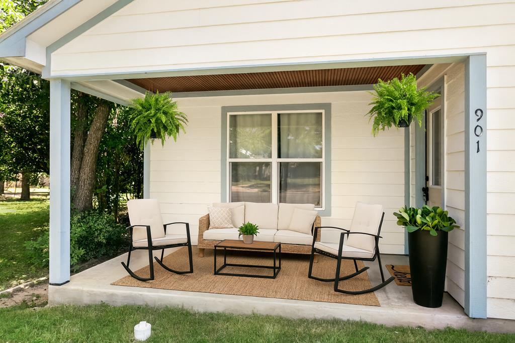 901 Bell Street Fredericksburg, TX 78624 - Photo 9 of 25 a roof deck with table and chairs and potted plants