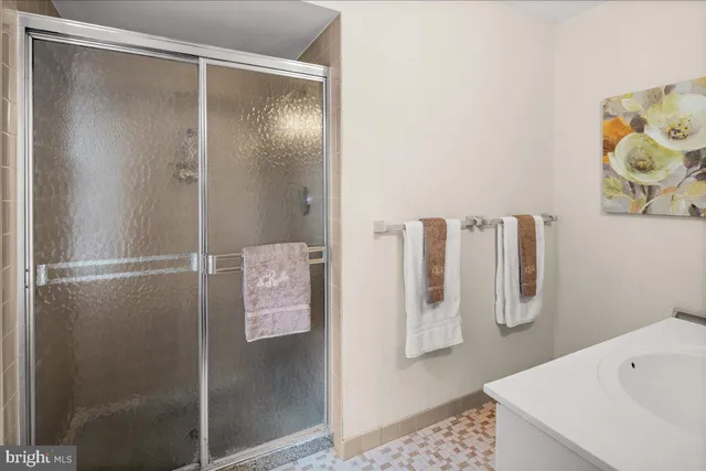a bedroom with a bed and a book shelf