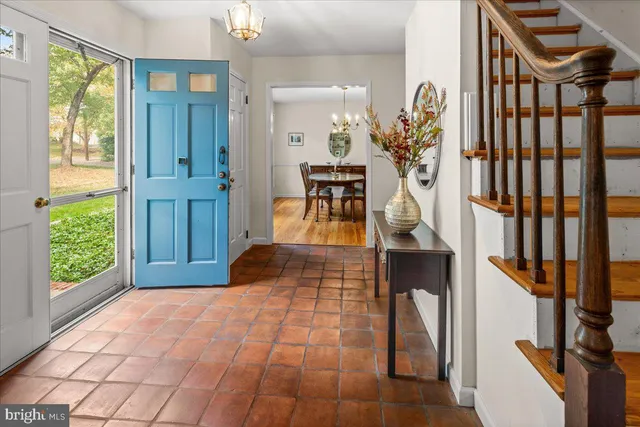 a view of entryway and hall with wooden floor