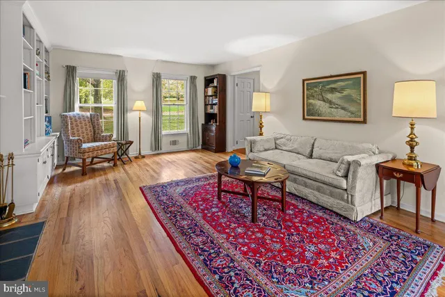 a living room with furniture and a rug