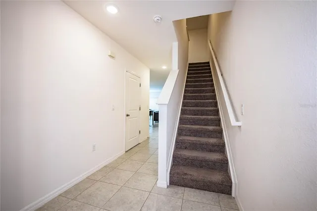 a view of a swimming pool with an outdoor seating and a residential houses