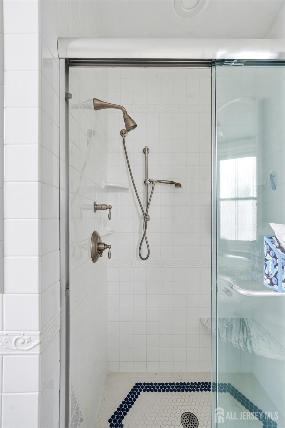 346 East Union Street Burlington, NJ 08016 - Photo 30 of 48 a bathroom with a glass shower door