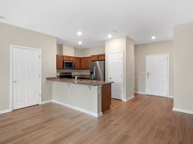 a view of kitchen with wooden floor