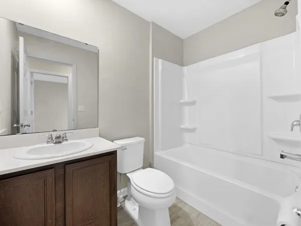 a bathroom with a sink a toilet and a bathtub
