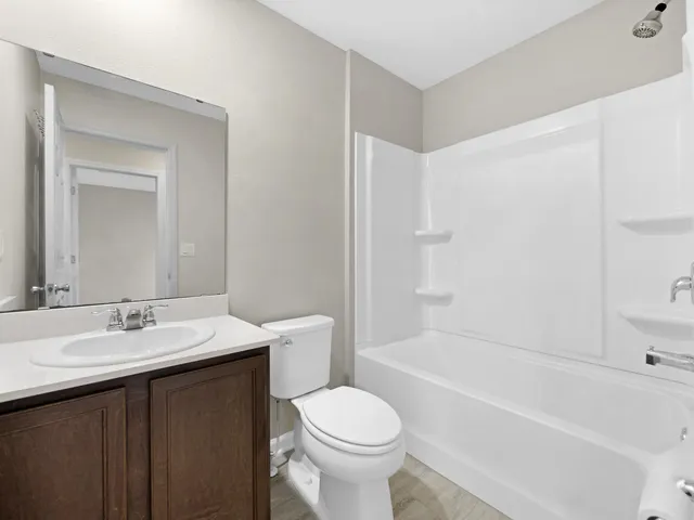 a bathroom with a sink a toilet and a bathtub