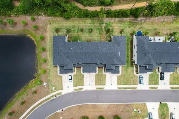 an aerial view of a house with a lake view