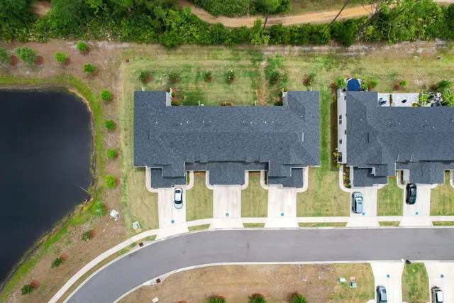 an aerial view of a house with a lake view