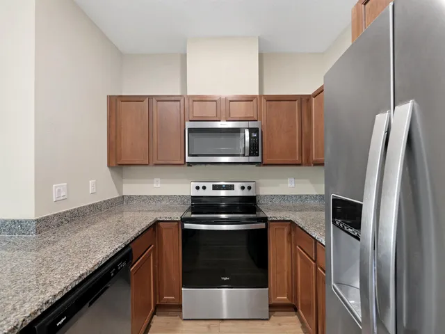 a kitchen with a stove and a microwave