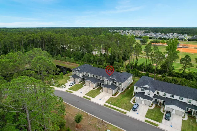 an aerial view of a house with a garden