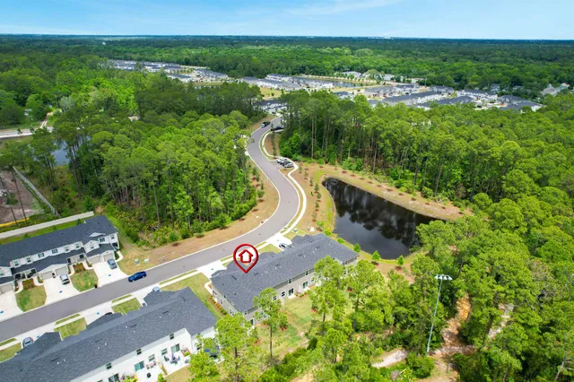 a swimming pool with some trees and plants