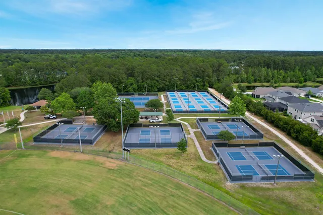 a view of a brick building next to a yard