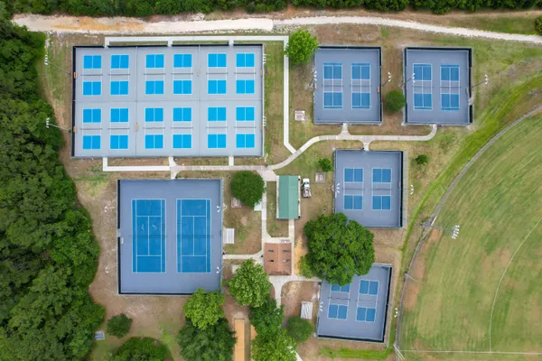 an aerial view of a house with a swimming pool