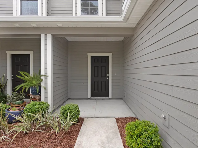 a view of a pathway besides a house