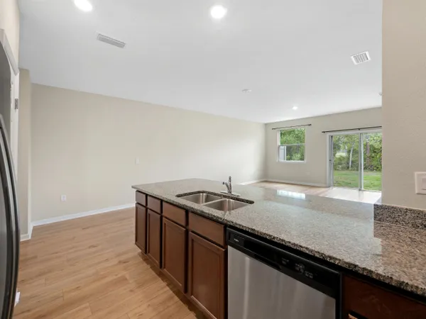 a kitchen with a sink and a window