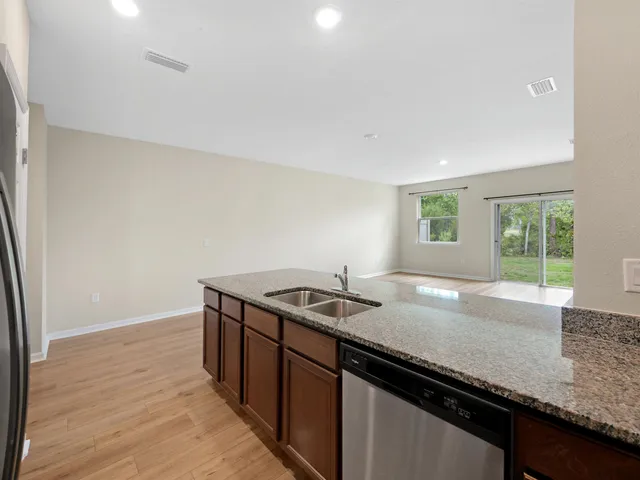 a kitchen with a sink and a window