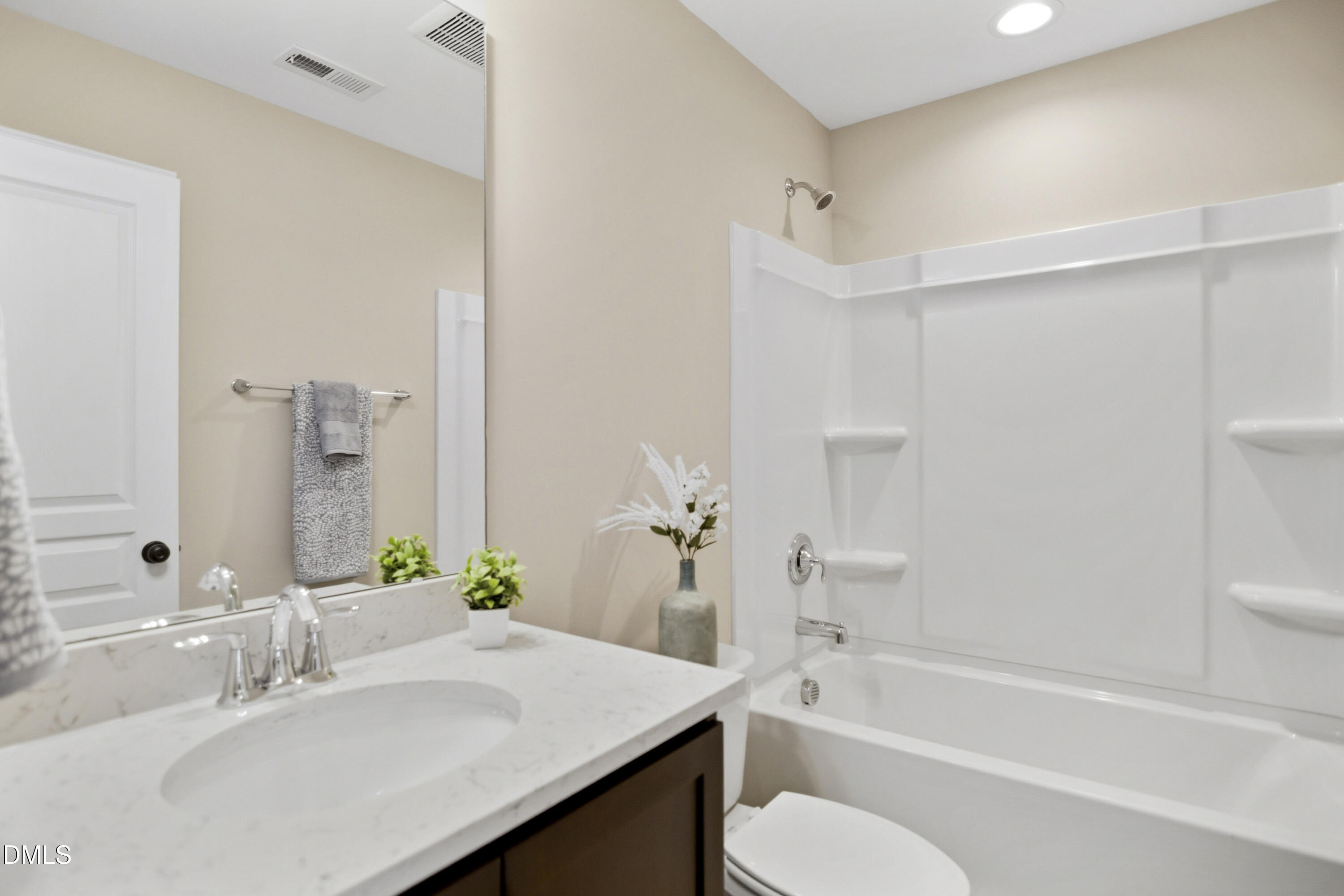 5916 Giddings Street Raleigh, NC 27616 - Photo 25 of 49 a bathroom with a sink toilet tub and shower