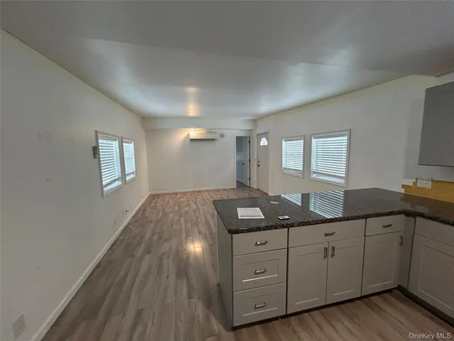 a kitchen with sink and cabinets