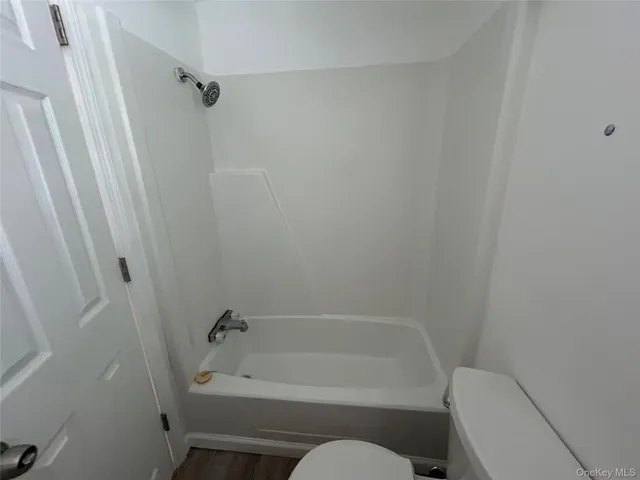 a bathroom with a tub and a sink