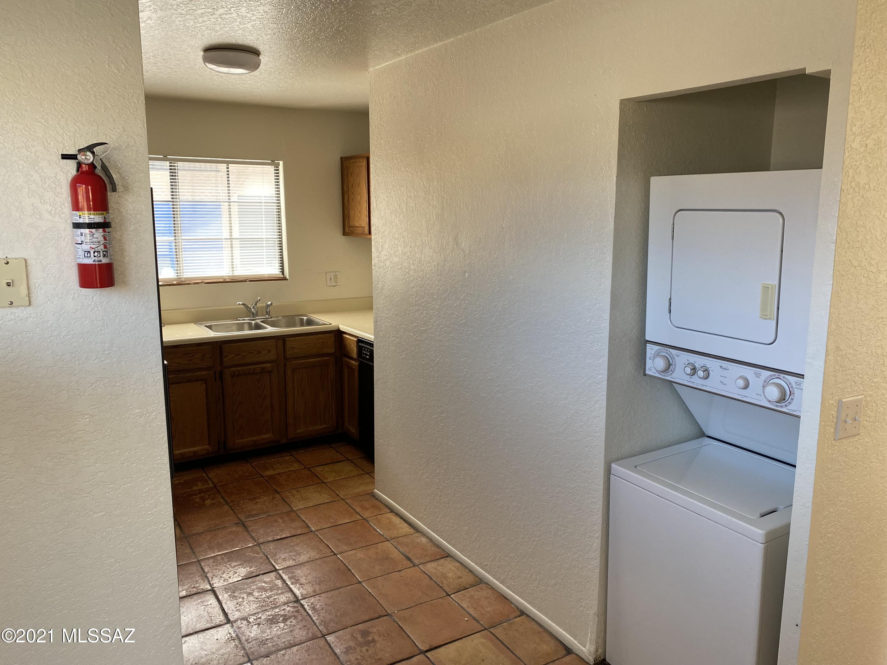 210 East Pastime Road Tucson, AZ 85705 - Photo 12 of 29 a view of cabinet with washer and dryer