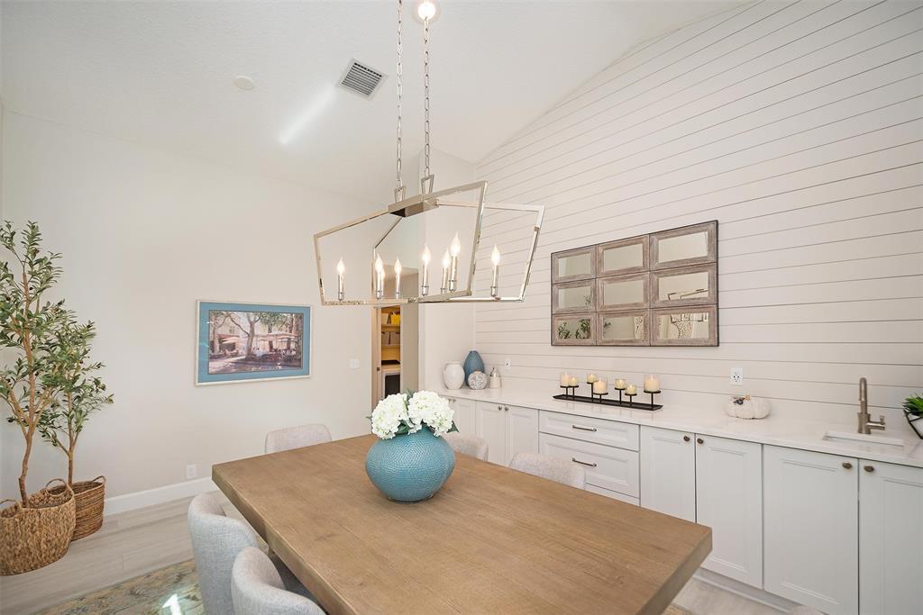 7810 Northwest 87th Avenue Tamarac, FL 33321 - Photo 11 of 21 a kitchen with stainless steel appliances a white stove top oven and cabinets