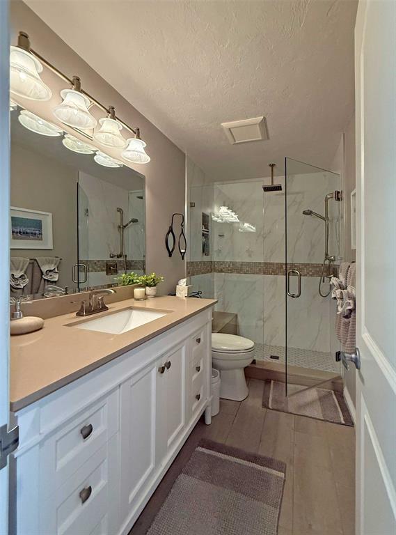 7810 Northwest 87th Avenue Tamarac, FL 33321 - Photo 17 of 21 a bathroom with a double vanity sink toilet and shower