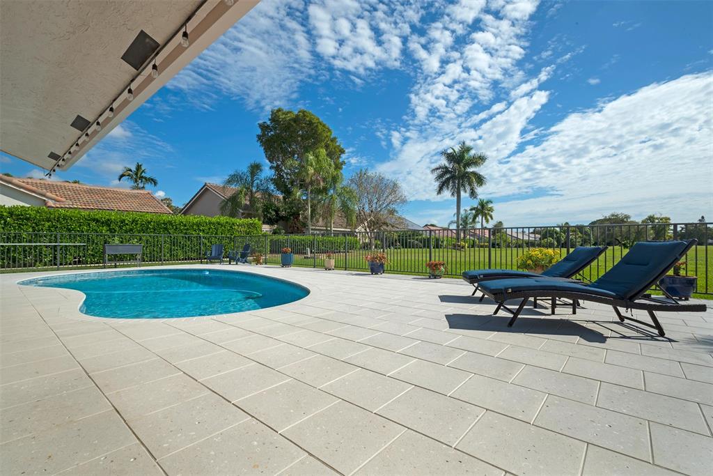 7810 Northwest 87th Avenue Tamarac, FL 33321 - Photo 18 of 21 a swimming pool with outdoor seating and yard