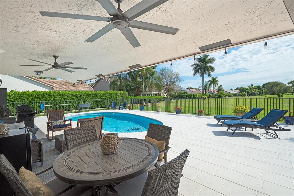 7810 Northwest 87th Avenue Tamarac, FL 33321 - Photo 20 of 21 a patio with a table and chairs