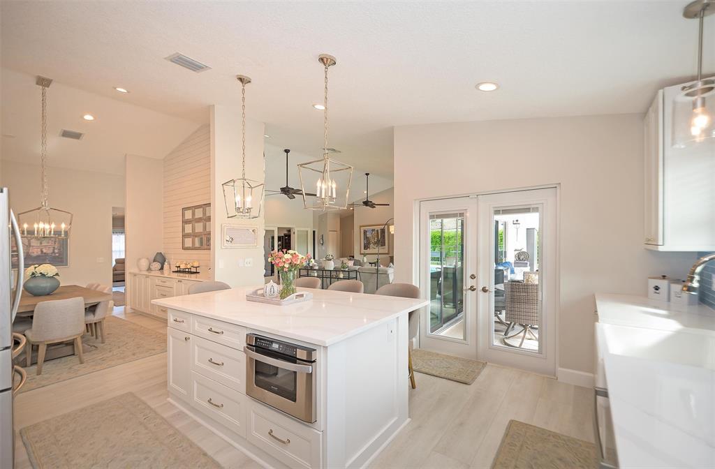 7810 Northwest 87th Avenue Tamarac, FL 33321 - Photo 7 of 21 a view of a kitchen with kitchen island a sink stainless steel appliances and cabinets