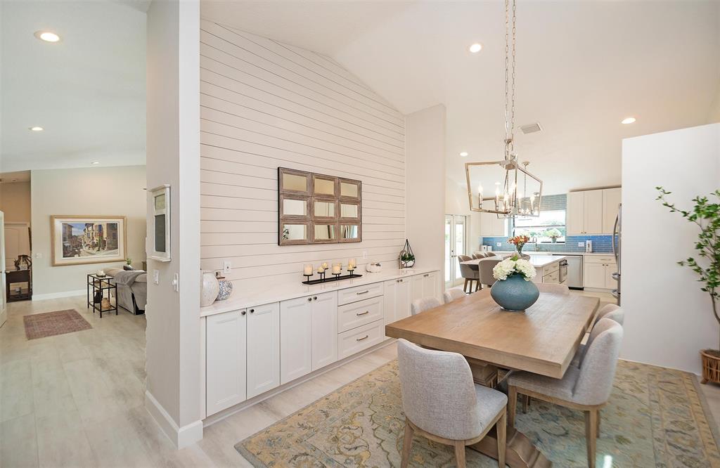 7810 Northwest 87th Avenue Tamarac, FL 33321 - Photo 10 of 21 a kitchen with stainless steel appliances kitchen island a table and chairs in it