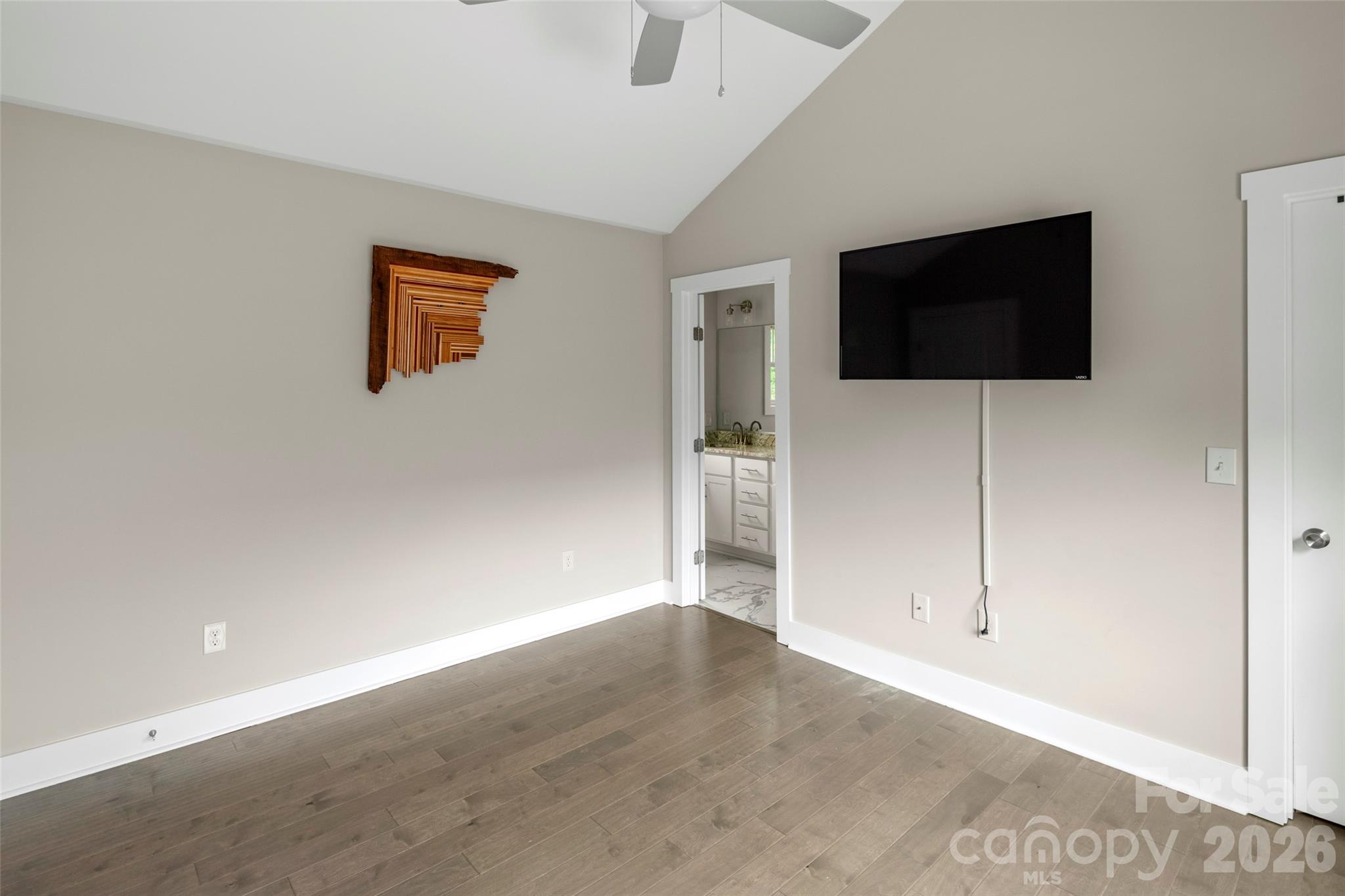 52 Wheeler Road Weaverville, NC 28787 - Photo 13 of 21 a view of a livingroom with an empty space & wooden floor