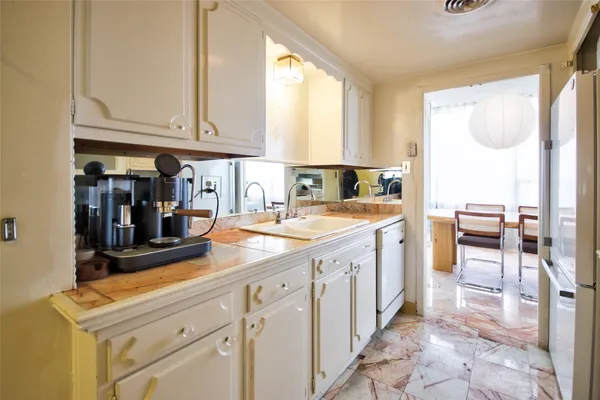 a kitchen with a sink and cabinets