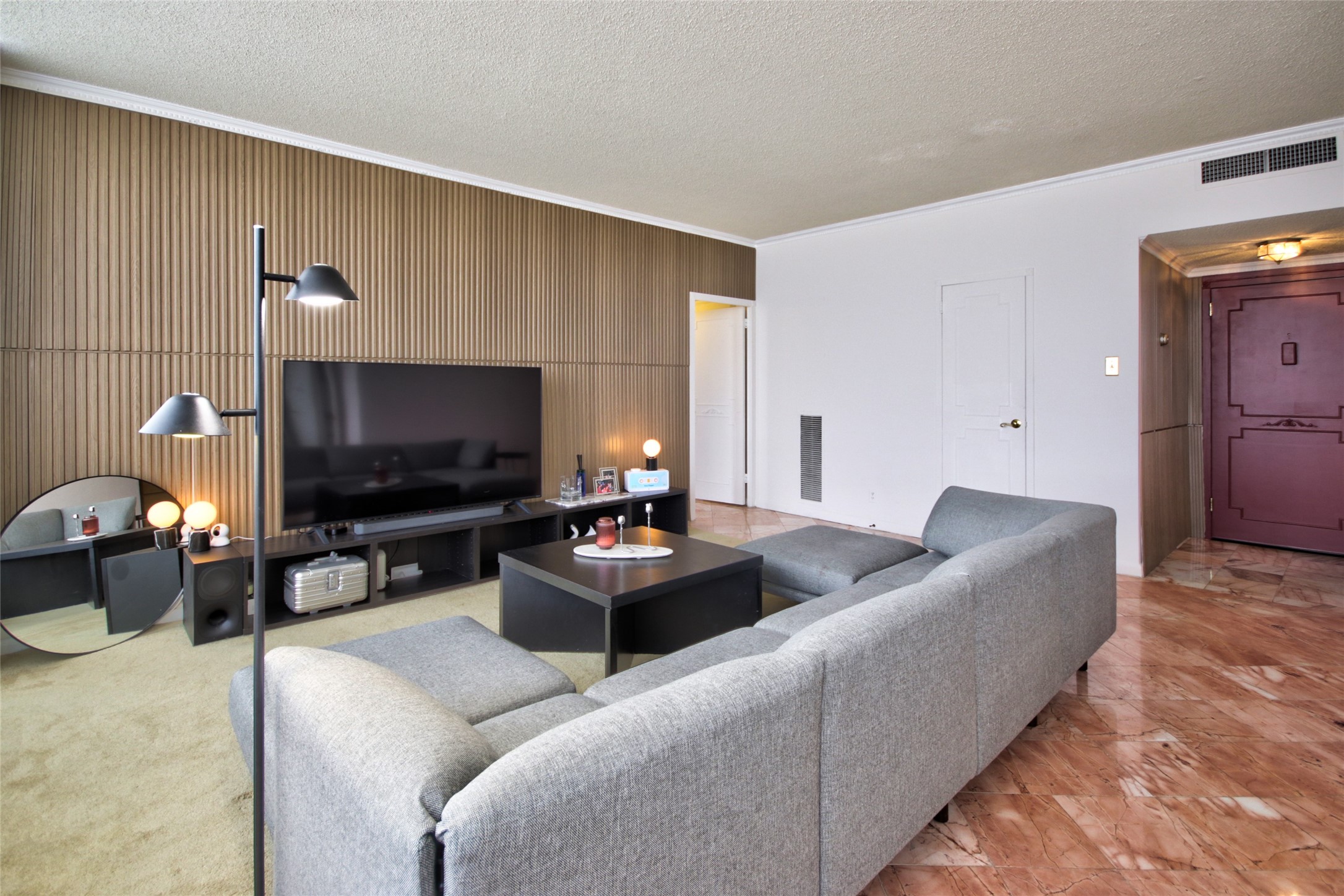 2701 Westheimer Road, Unit 7H Houston, TX 77098 - Photo 15 of 21 a living room with furniture and a flat screen tv