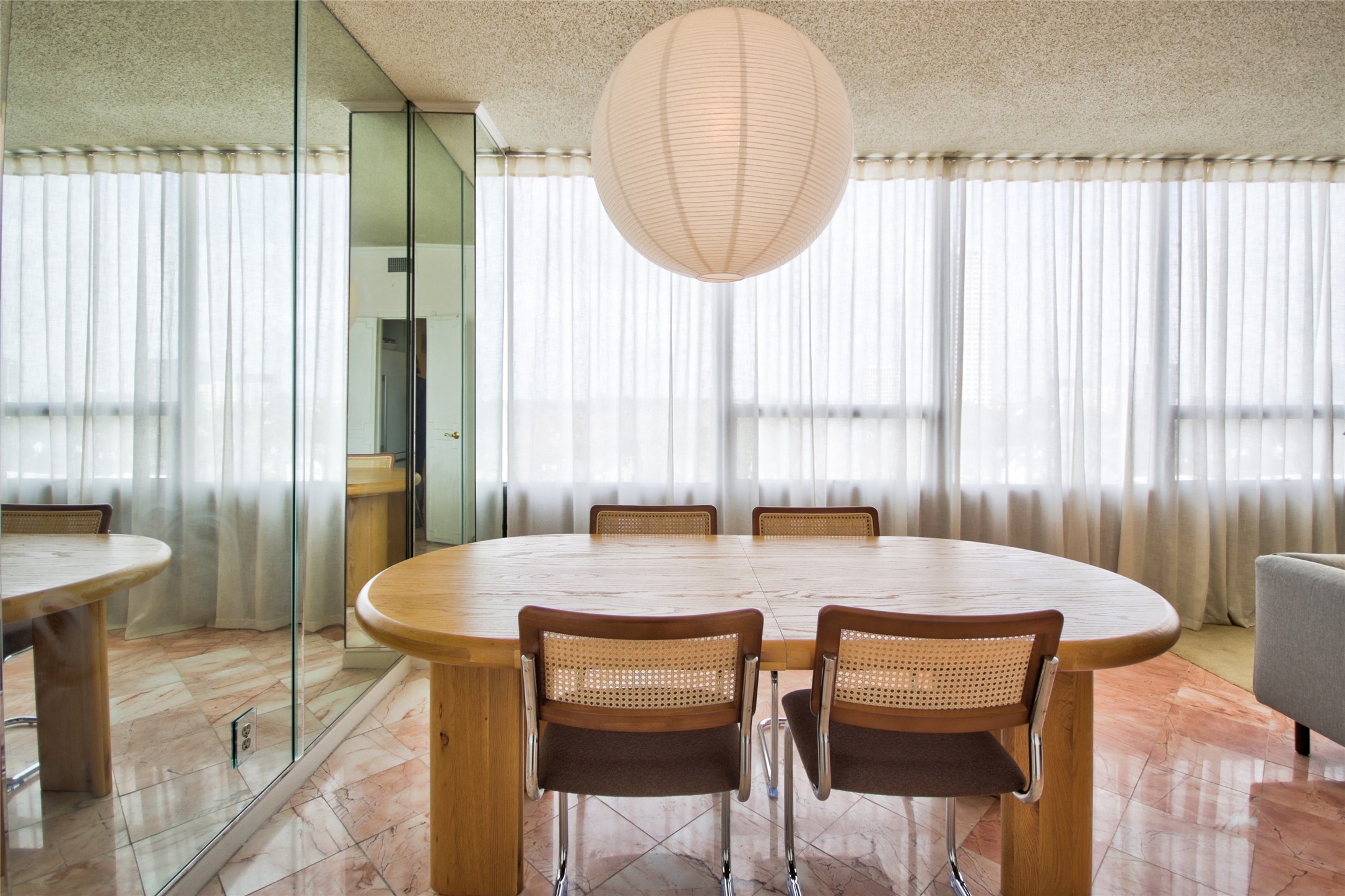 2701 Westheimer Road, Unit 7H Houston, TX 77098 - Photo 8 of 21 a view of a dining room with furniture and a window