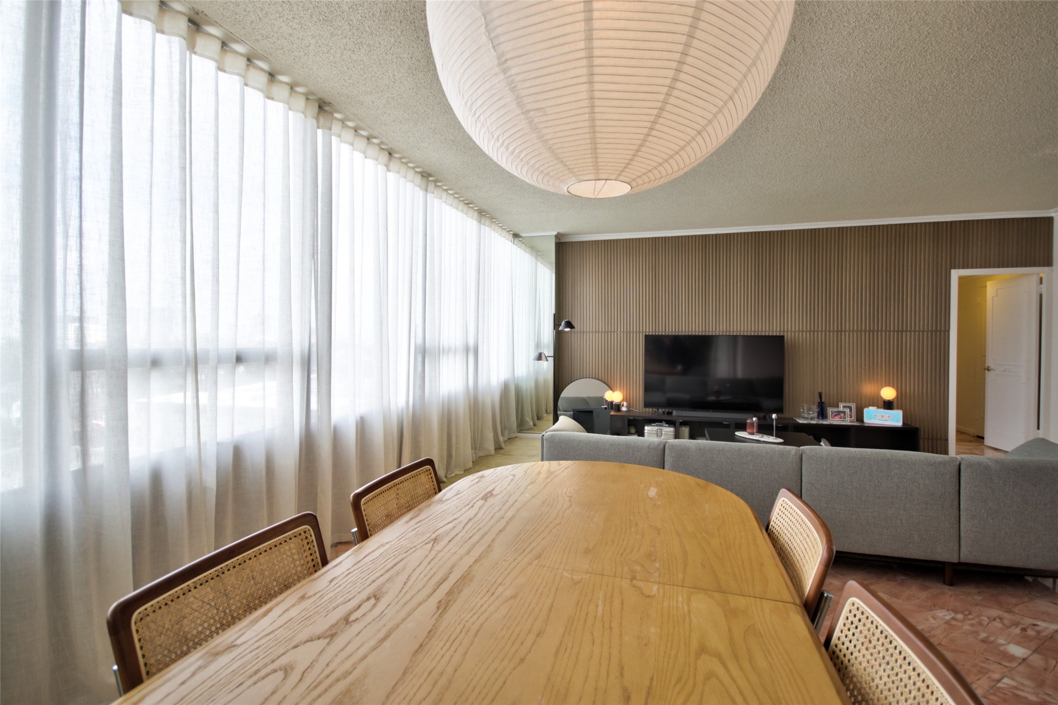 2701 Westheimer Road, Unit 7H Houston, TX 77098 - Photo 10 of 21 a bedroom with bed and a flat screen tv