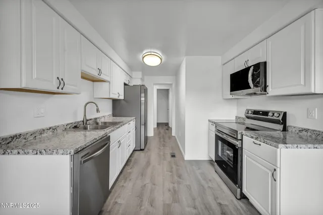 a view of an empty room and closet area
