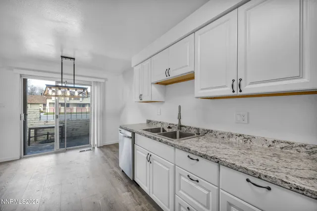 a bathroom with a toilet a sink a vanity and mirror